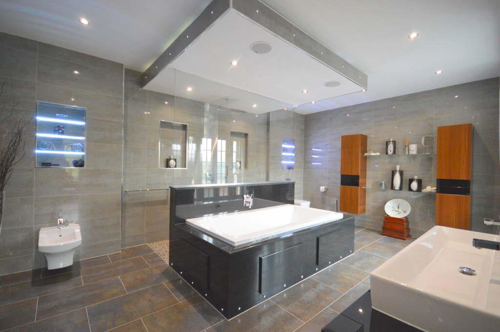 Tile flooring installed throughout the bathroom, large format tile flooring,