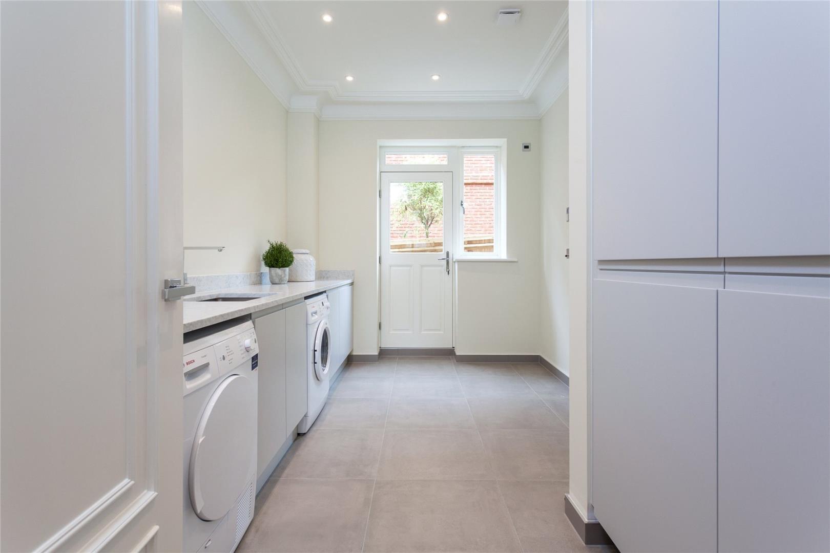 Large format tile installed in a laundry room